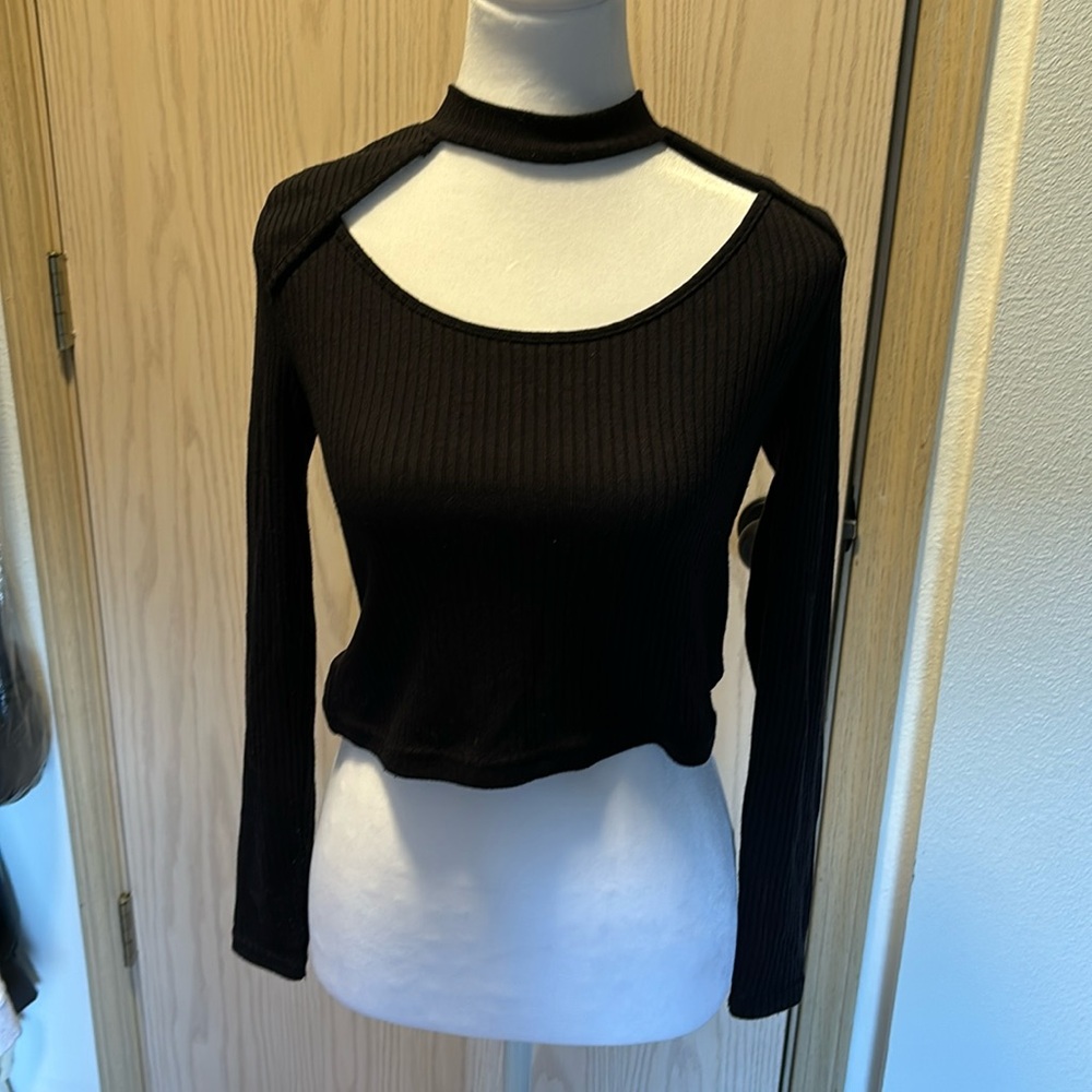 Black, slightly cropped shirt. Size small.